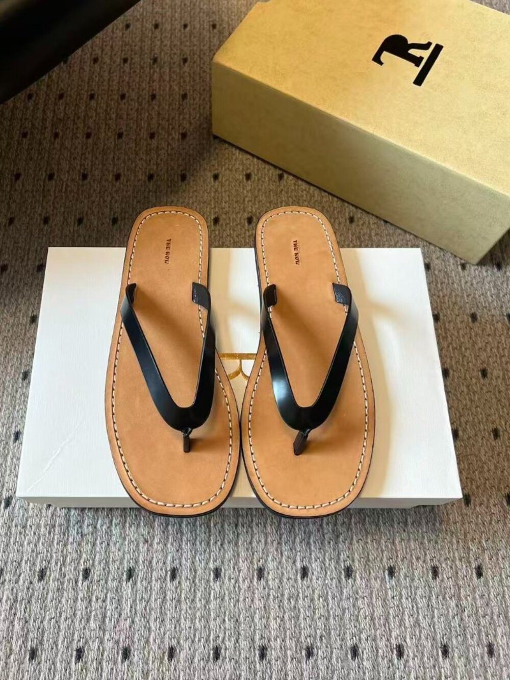 The Row Black Leather Thong Flip‑Flop Sandals